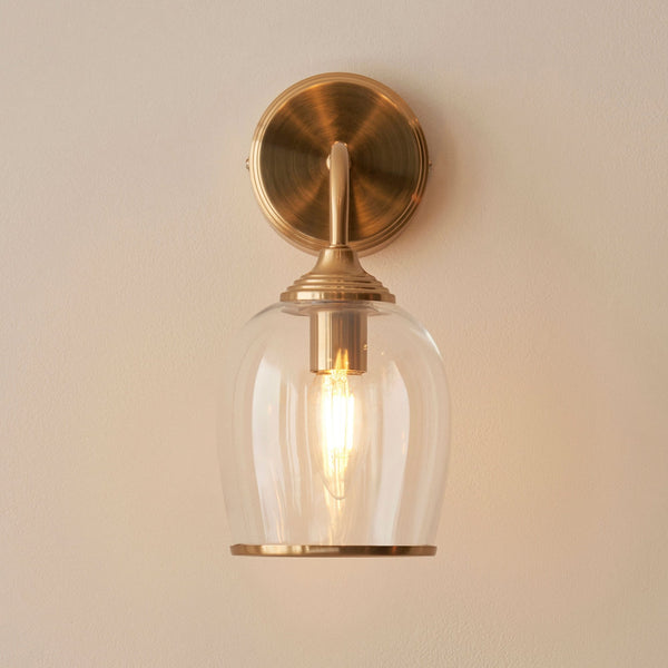 Ashcroft Wall Light in Brushed Aged Brass & Clear Glass Shade with Metal Trim Edge