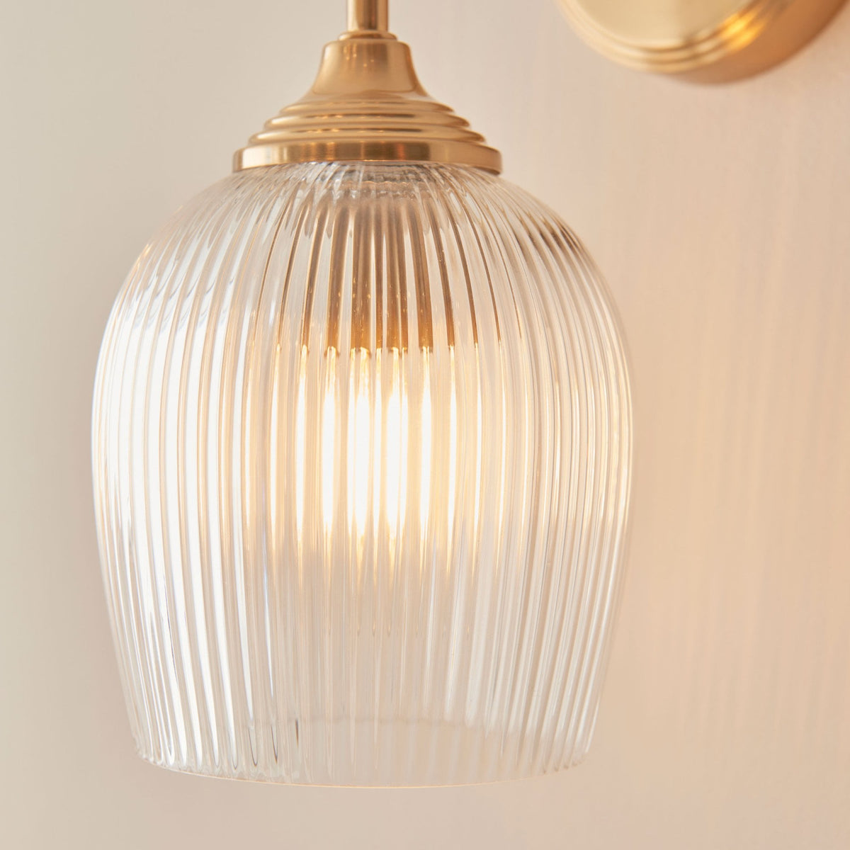Ashcroft Wall Light in Brushed Aged Brass & Clear Ribbed Glass Shade