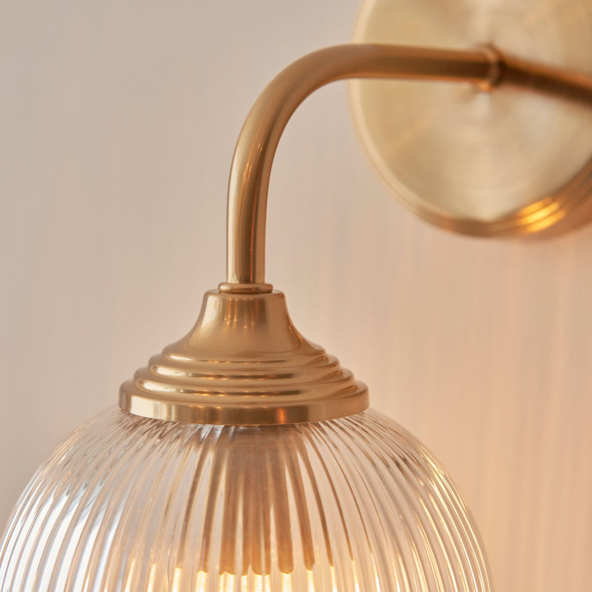 Ashcroft Wall Light in Brushed Aged Brass & Clear Ribbed Glass Shade