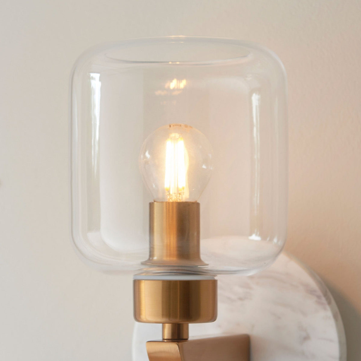 Travi Wall Light in Vintage Brass & White Volakas Marble with Clear Glass Shade