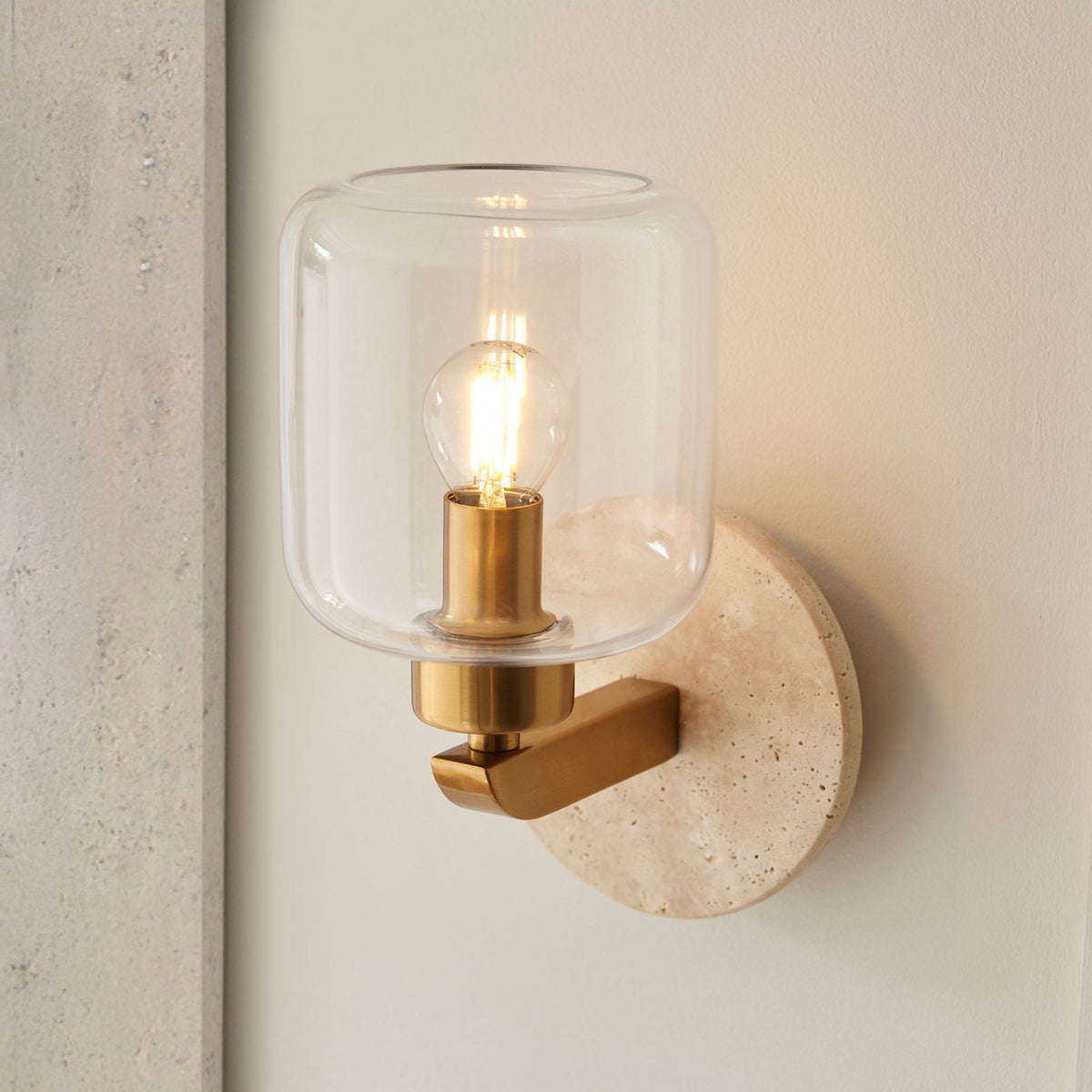 Travi Wall Light in Vintage Brass & Natural Travertine Stone with Clear Glass Shade