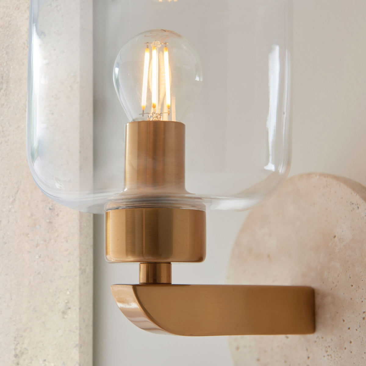 Travi Wall Light in Vintage Brass & Natural Travertine Stone with Clear Glass Shade