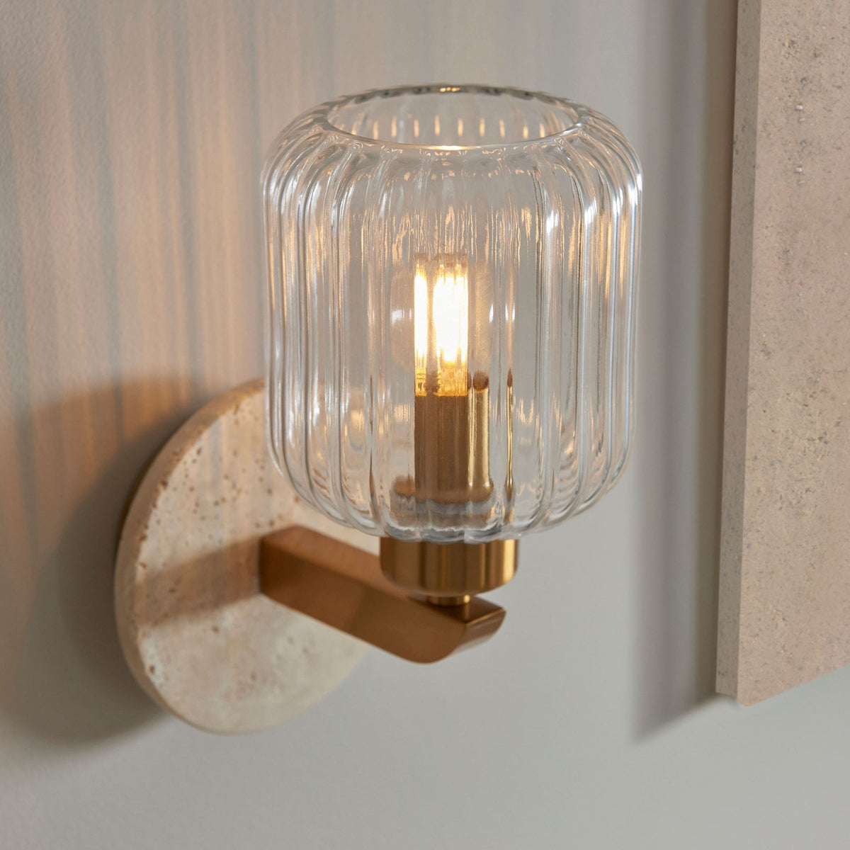 Travi Wall Light in Vintage Brass & Natural Travertine Stone with Clear Ribbed Glass Shade
