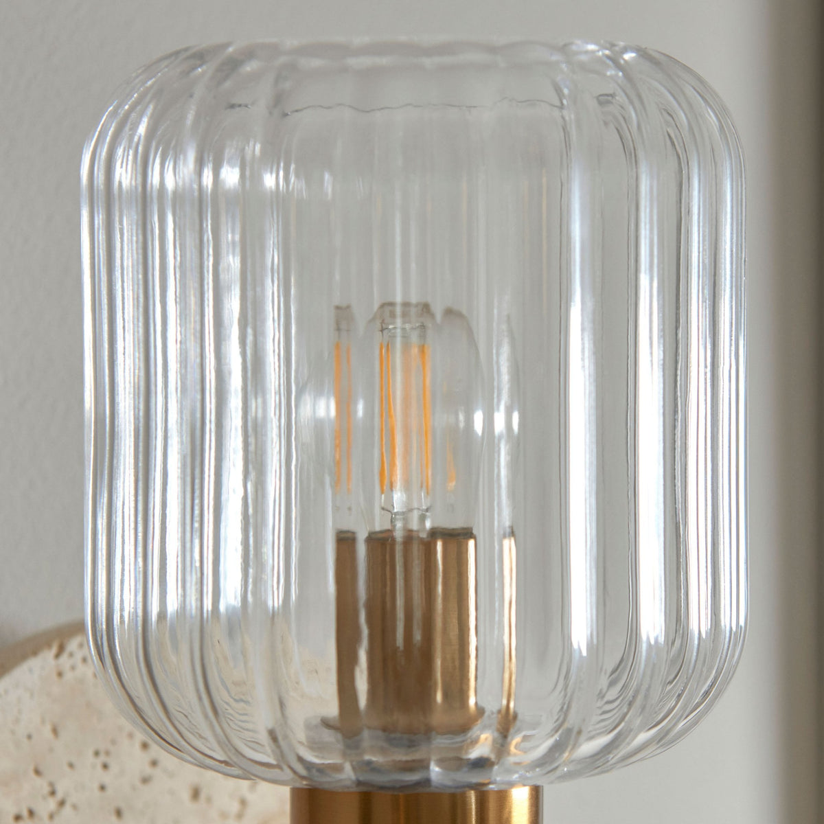 Travi Wall Light in Vintage Brass & Natural Travertine Stone with Clear Ribbed Glass Shade