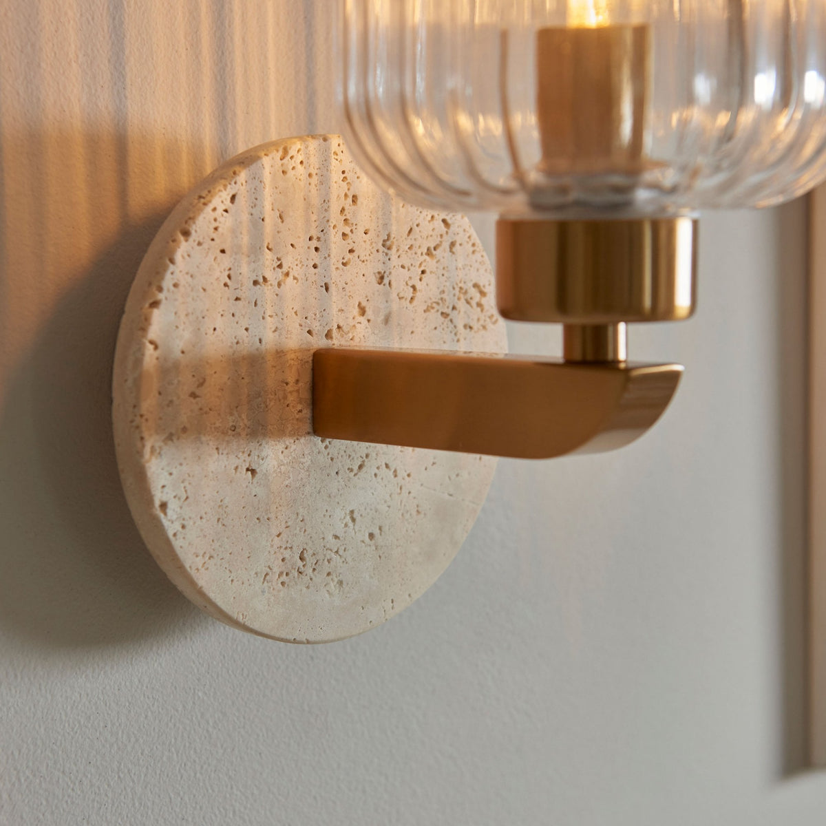 Travi Wall Light in Vintage Brass & Natural Travertine Stone with Clear Ribbed Glass Shade