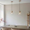 Travi Single Drop Pendant in Vintage Brass & Natural Travertine Stone with Clear Glass Shade