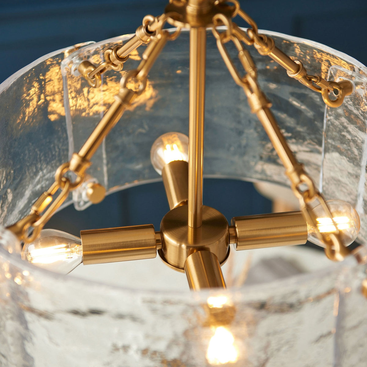 Keller Four Lamp Pendant in Brushed Aged Brass with Handmade Clear Textured Curved Glass Panels