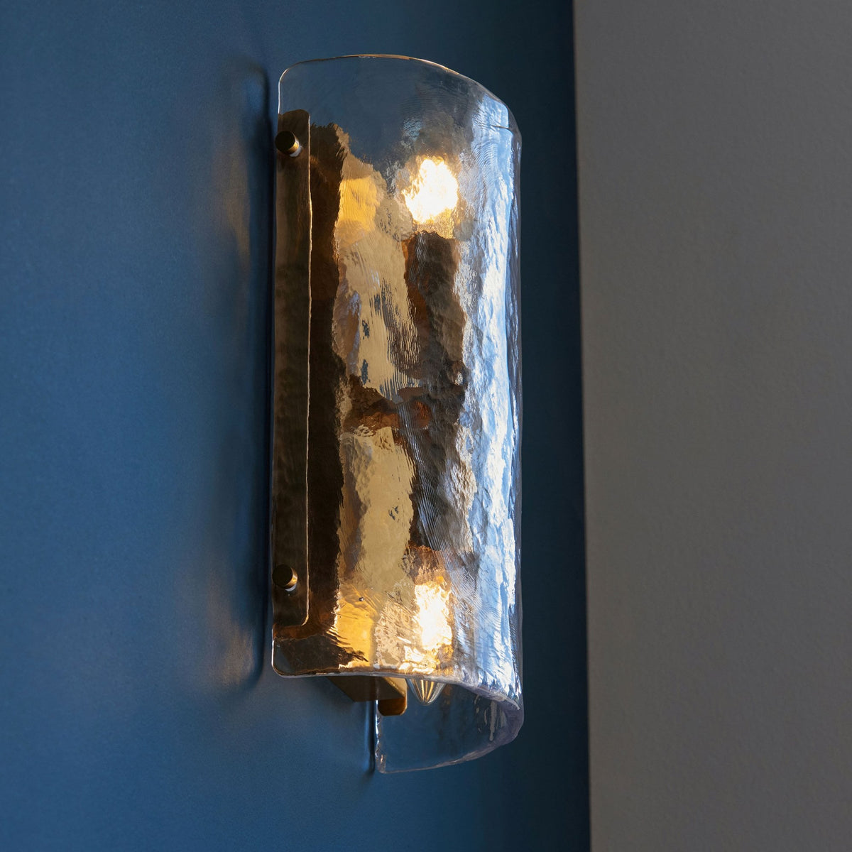 Keller Wall Light in Brushed Aged Brass with Handmade Clear Textured Curved Glass Panel