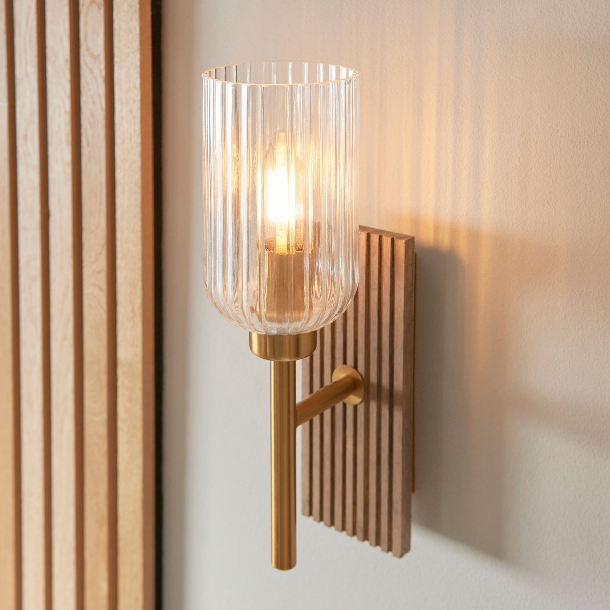 Grove Wall Light in Vintage Brass & Grooved Stained Beechwood Backplate with Clear Ribbed Glass