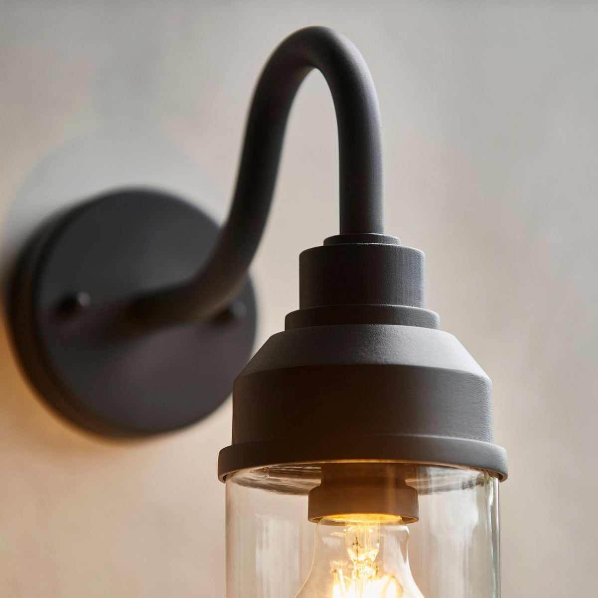Truro IP44 Wall Light in Matt Black with Clear Glass Shade