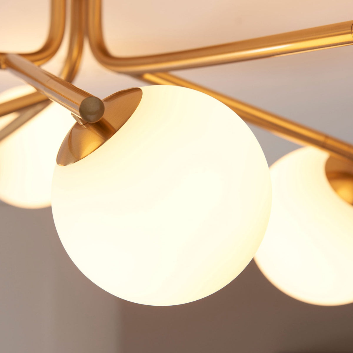 Aaron Six Lamp Semi Flush Ceiling Light in Brushed Aged Brass & Matt Opal Duplex Glass Spheres