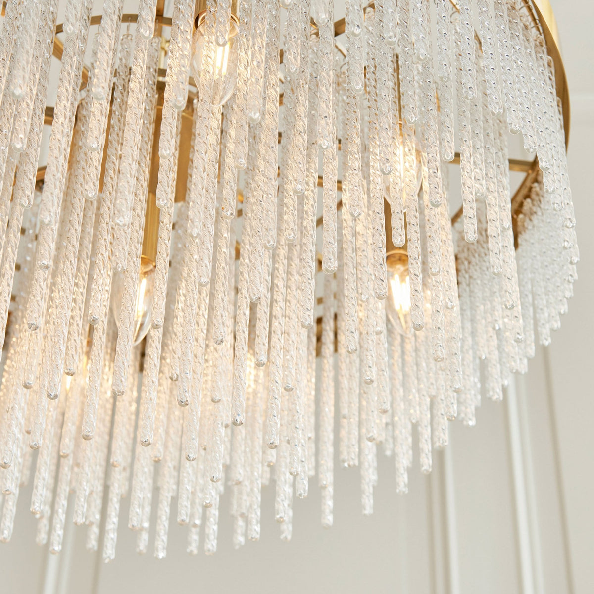 Anistoria Grand Nine Light Pendant in Brushed Aged Brass & Twisted Clear Decorative Glass Rods