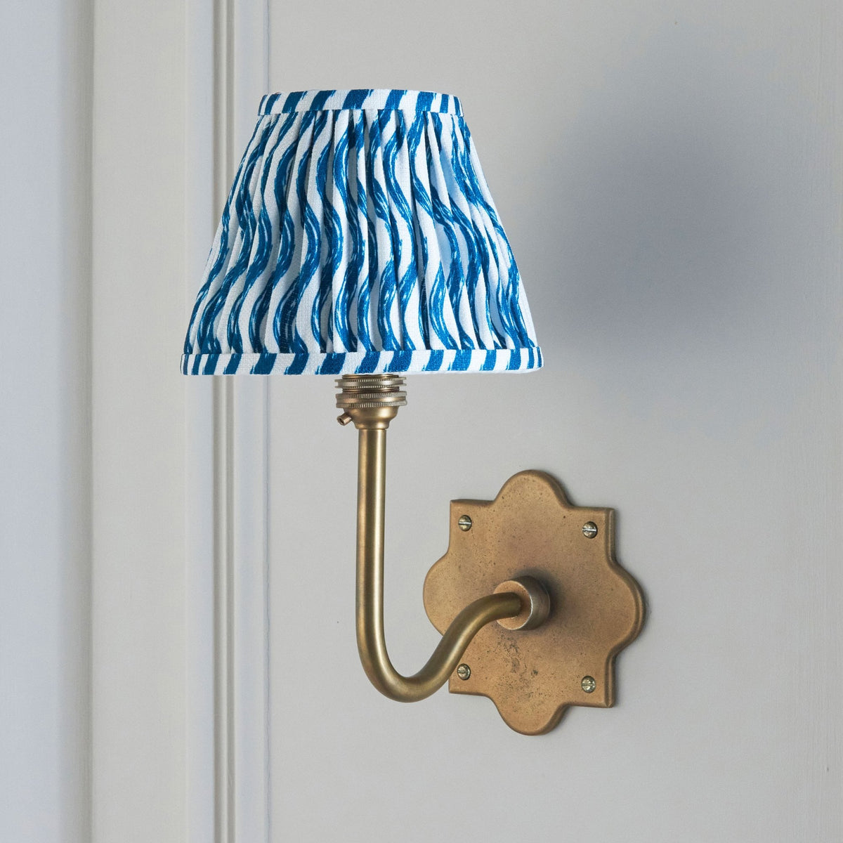 Anvil Swan Wall Light in Brass Patina with 16cm Ripple Marlin Blue Faux Linen Fabric Shade
