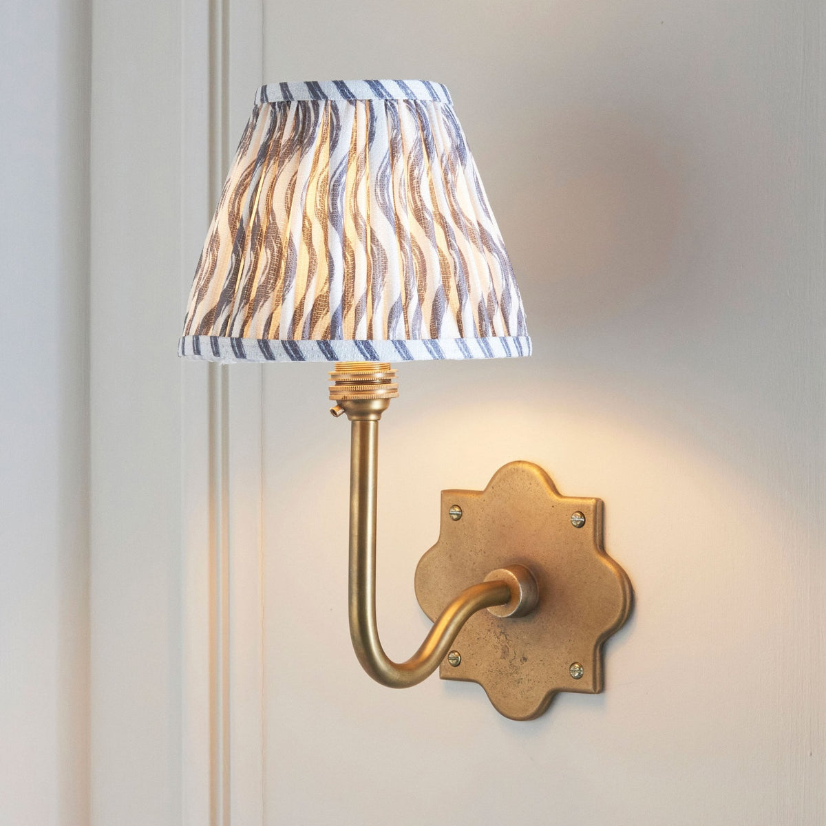 Anvil Swan Wall Light in Brass Patina with 16cm Ripple Pearl Grey Faux Linen Fabric Shade