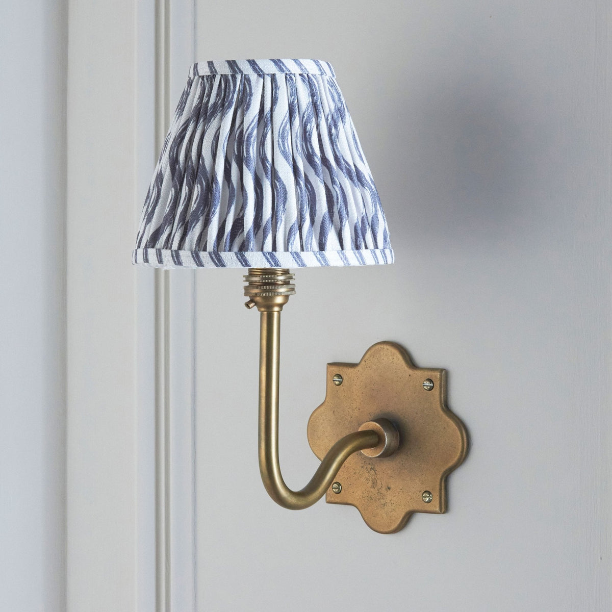 Anvil Swan Wall Light in Brass Patina with 16cm Ripple Pearl Grey Faux Linen Fabric Shade