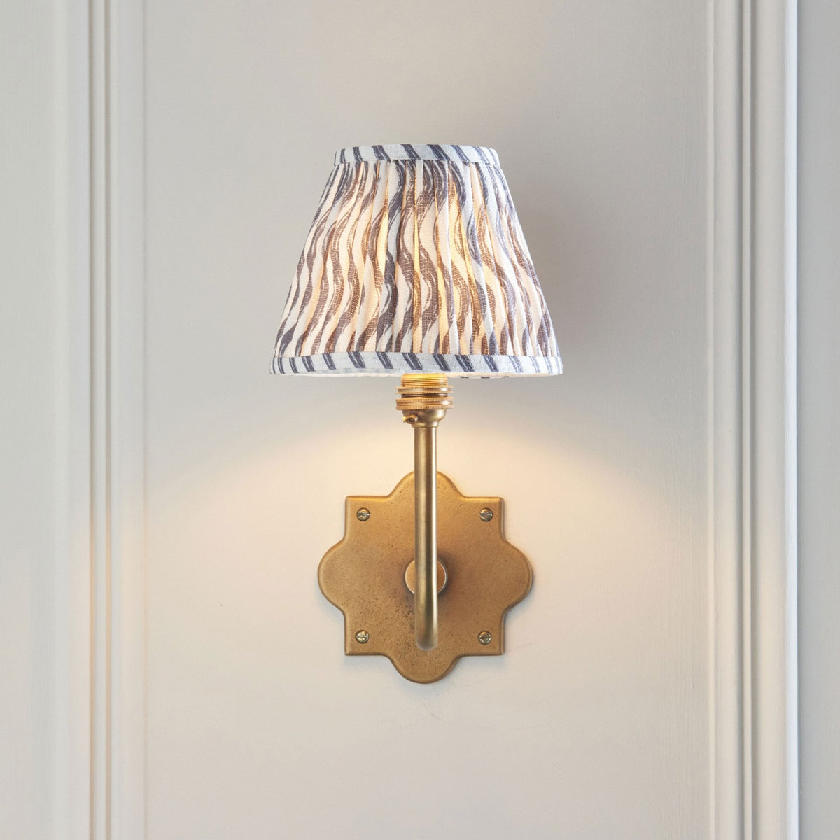 Anvil Swan Wall Light in Brass Patina with 16cm Ripple Pearl Grey Faux Linen Fabric Shade