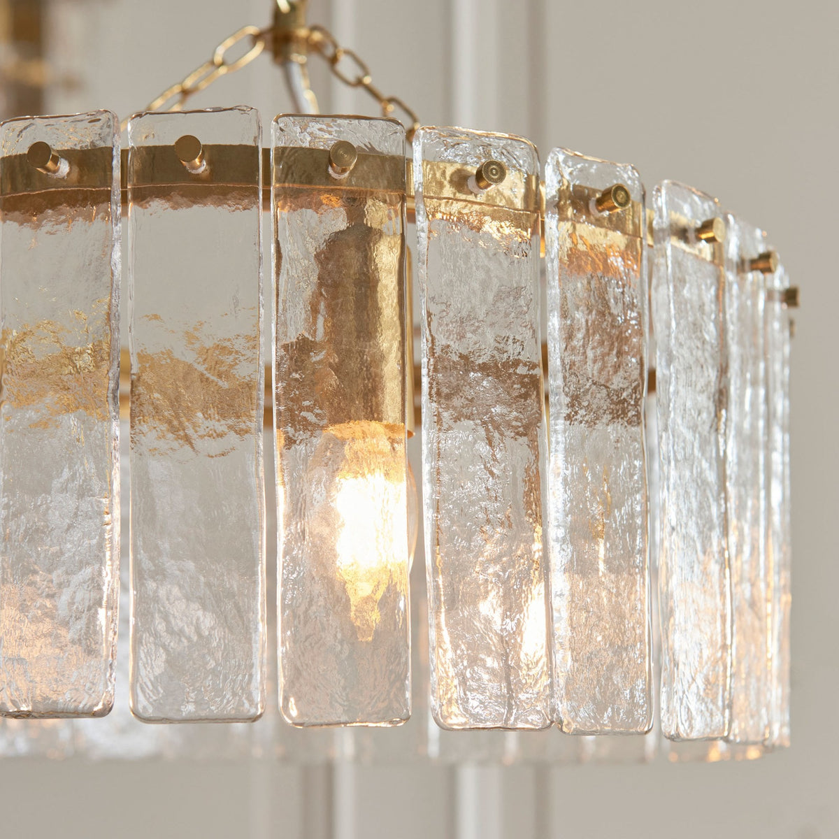 Karine Three Light Pendant in Brushed Aged Brass with Handmade Clear Textured Glass Panels