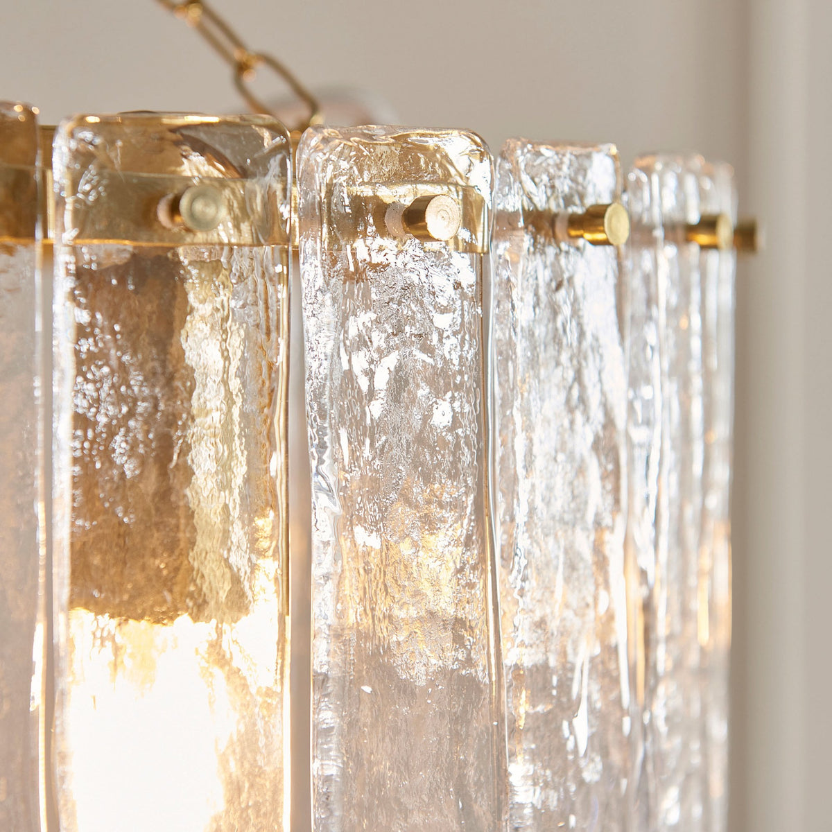 Karine Three Light Pendant in Brushed Aged Brass with Handmade Clear Textured Glass Panels