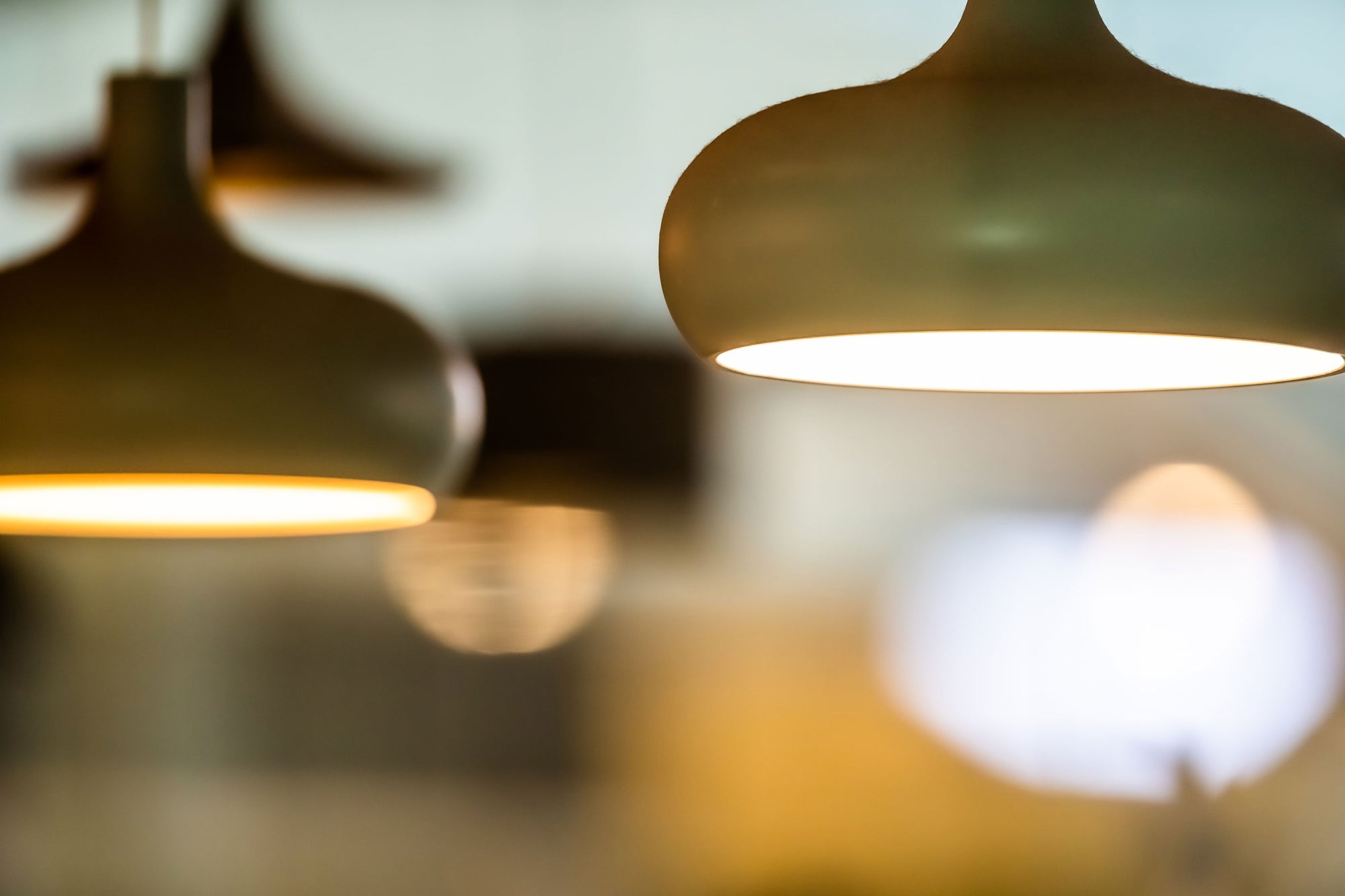 Three pendant lights with warm glow