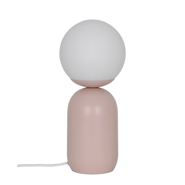 Pink table lamp with a white spherical shade on a white background