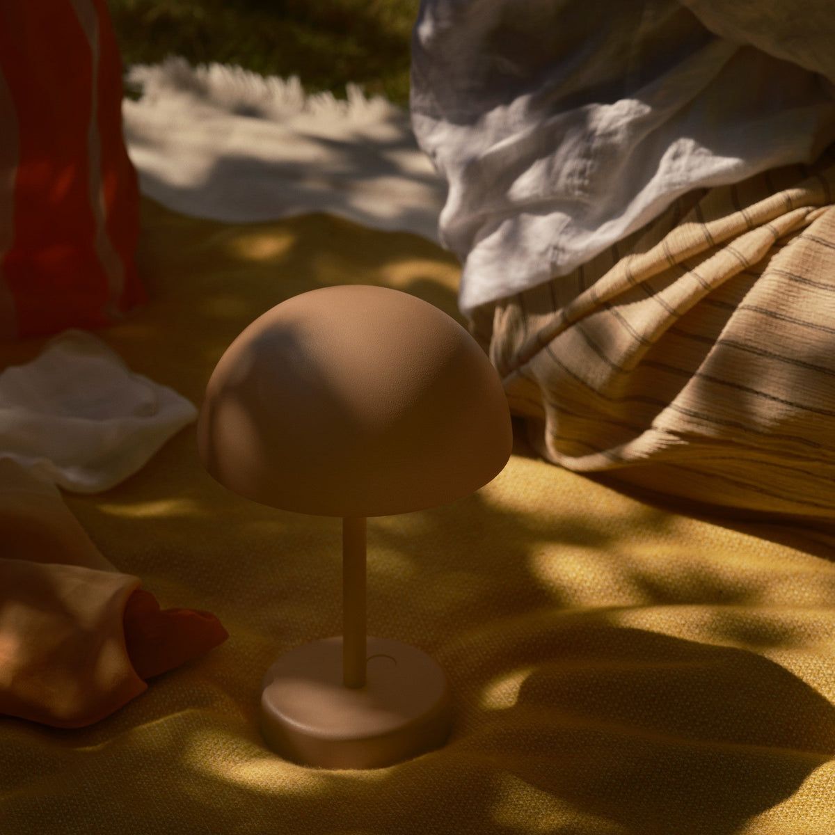 Mushroom-shaped lamp on a yellow blanket
