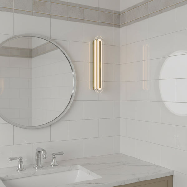 Bathroom vanity with a round mirror, white subway tiles, and a vertical light fixture