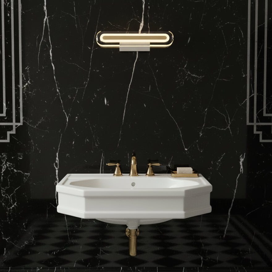 White hexagonal sink with gold faucet against black marble wall with white veins