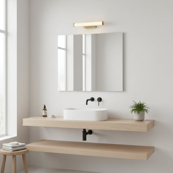 Modern bathroom with a white oval sink, black faucet, and a light wood floating vanity