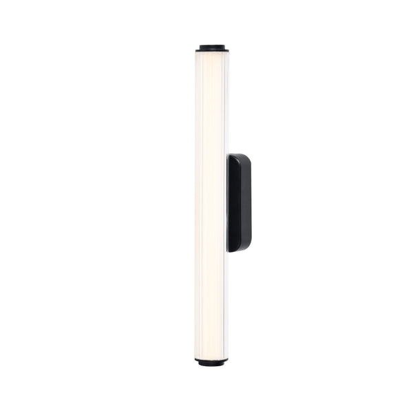 Vertical ribbed glass wall sconce with black metal base and top, emitting a warm glow