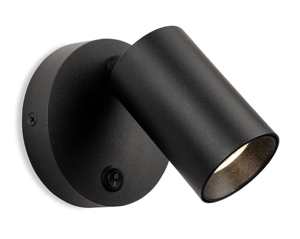 Black wall-mounted spotlight with an integrated switch and a textured finish
