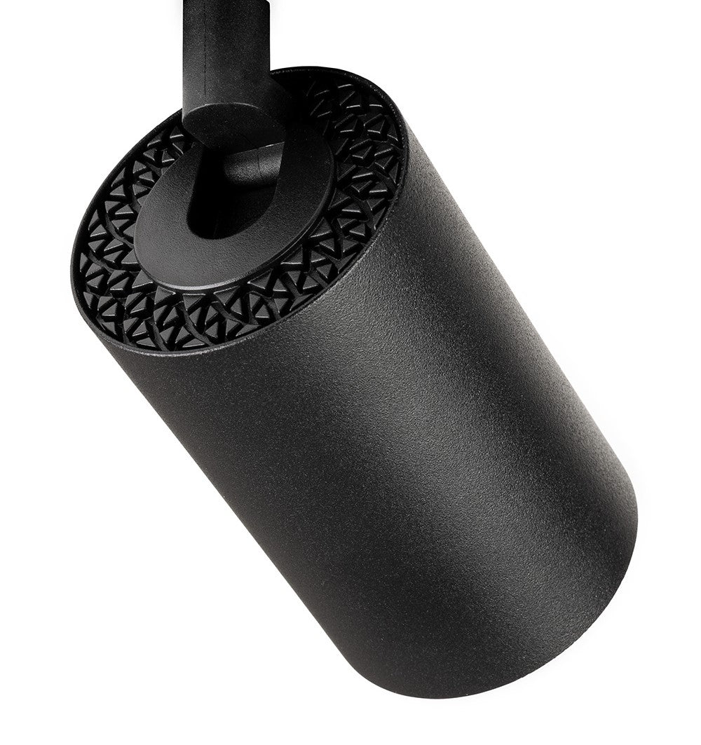 Black cylindrical track light with a textured top surface