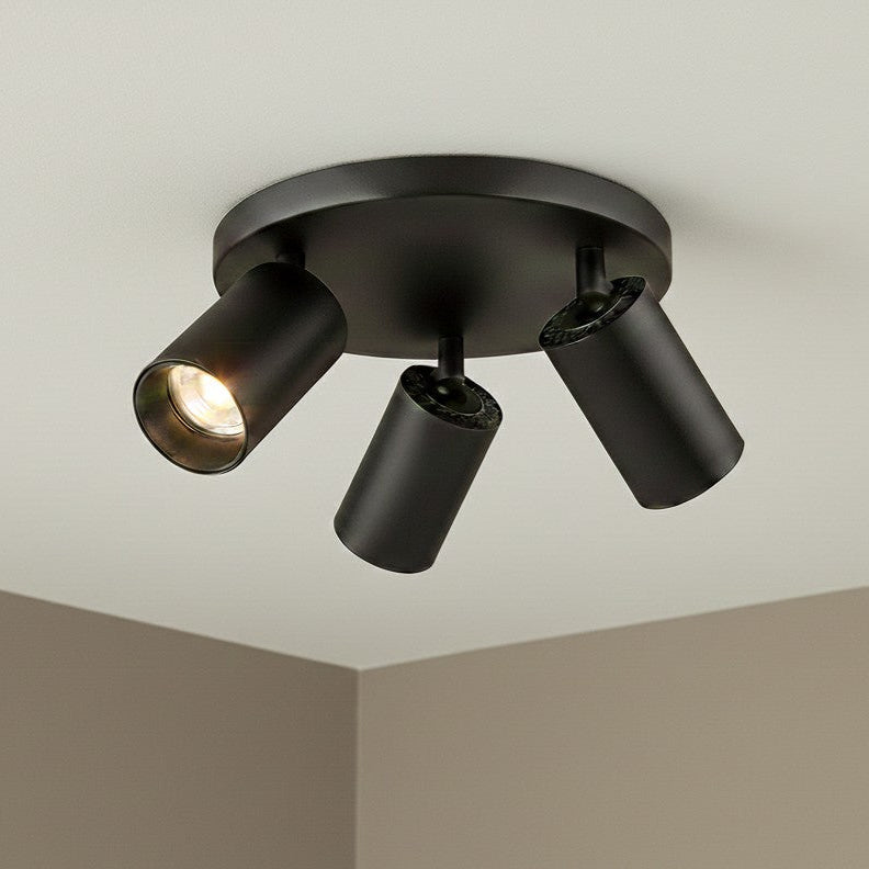 Black three-light ceiling spotlight fixture with one light illuminated