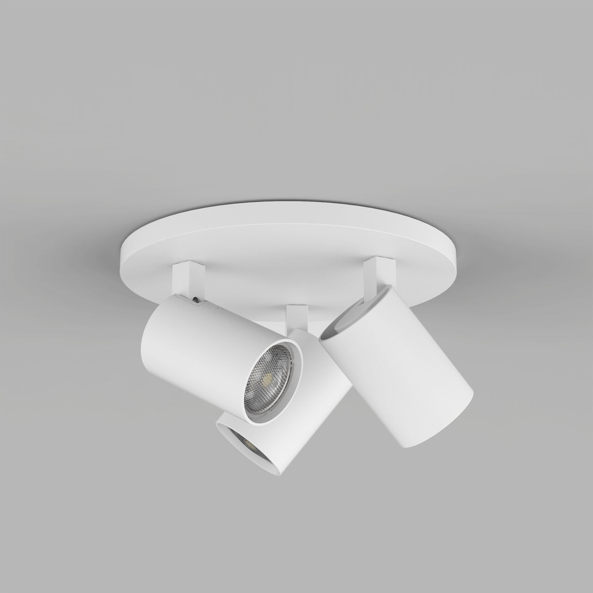 White ceiling light fixture with three adjustable cylindrical spotlights