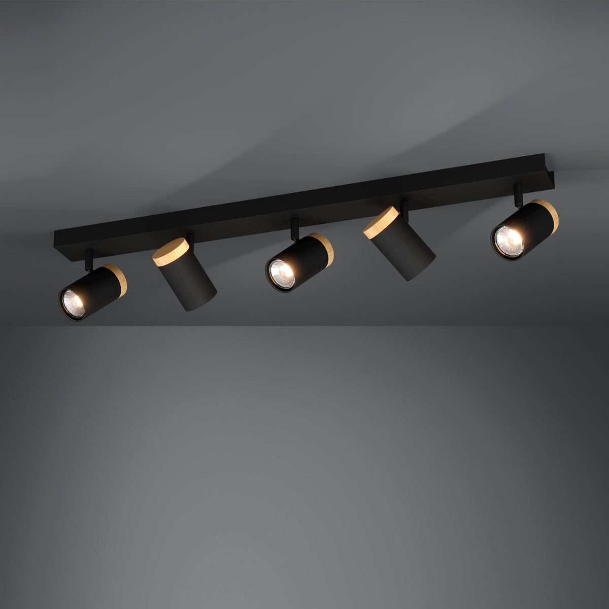 Black track lighting with five adjustable spotlights, each featuring a light wood accent.