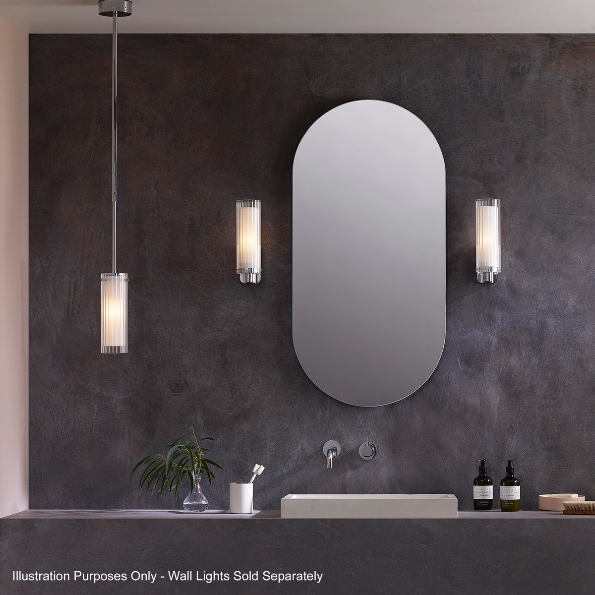 Bathroom with a rectangular sink, a tall oval mirror, and a pendant light and two wall lights
