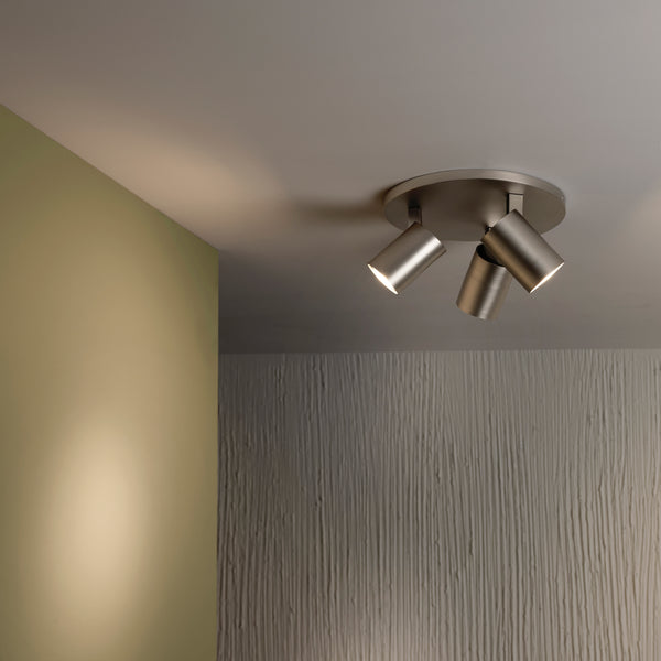 Three spot lights on a ceiling