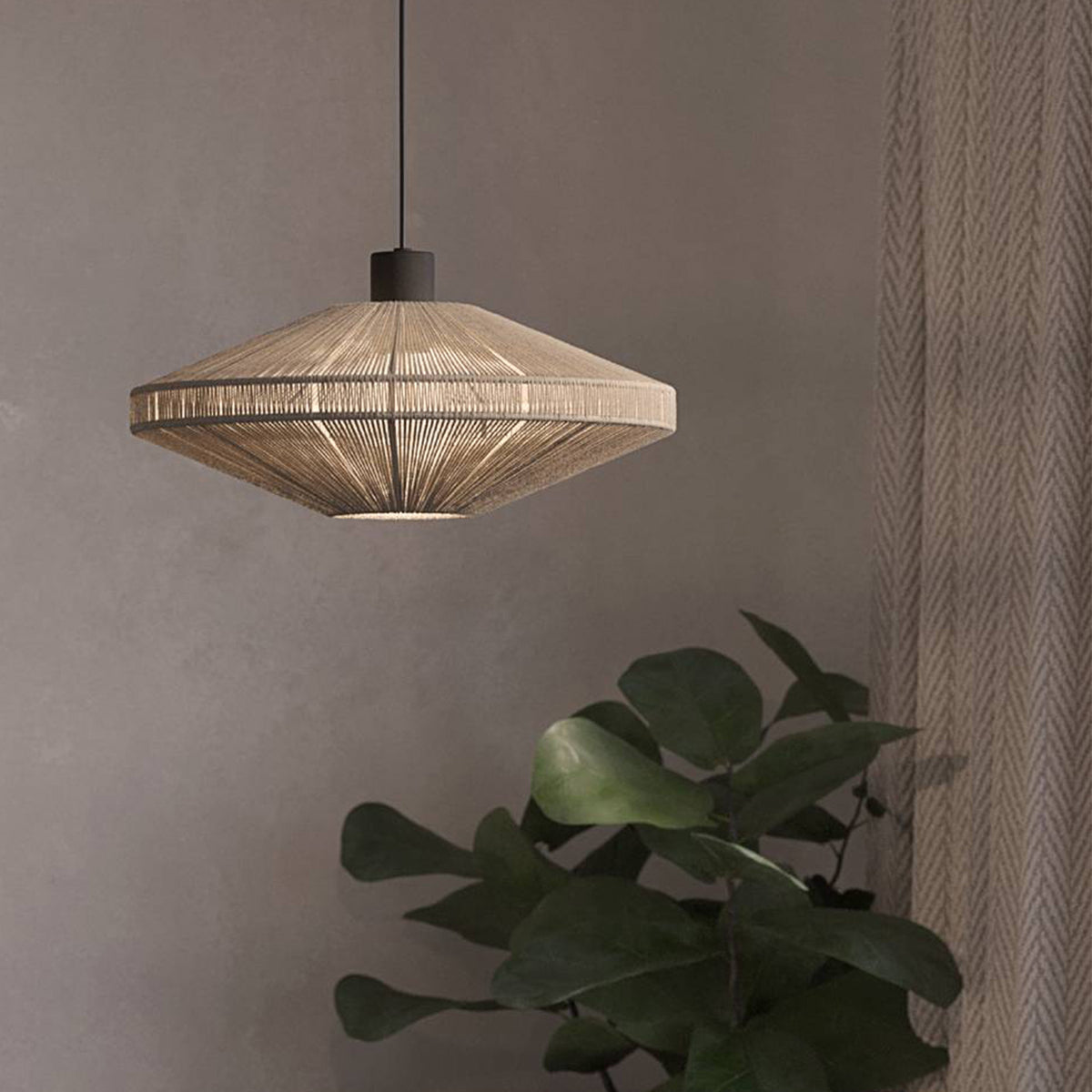 A modern pendant light with a woven, conical shade hangs from the ceiling, illuminating the space below