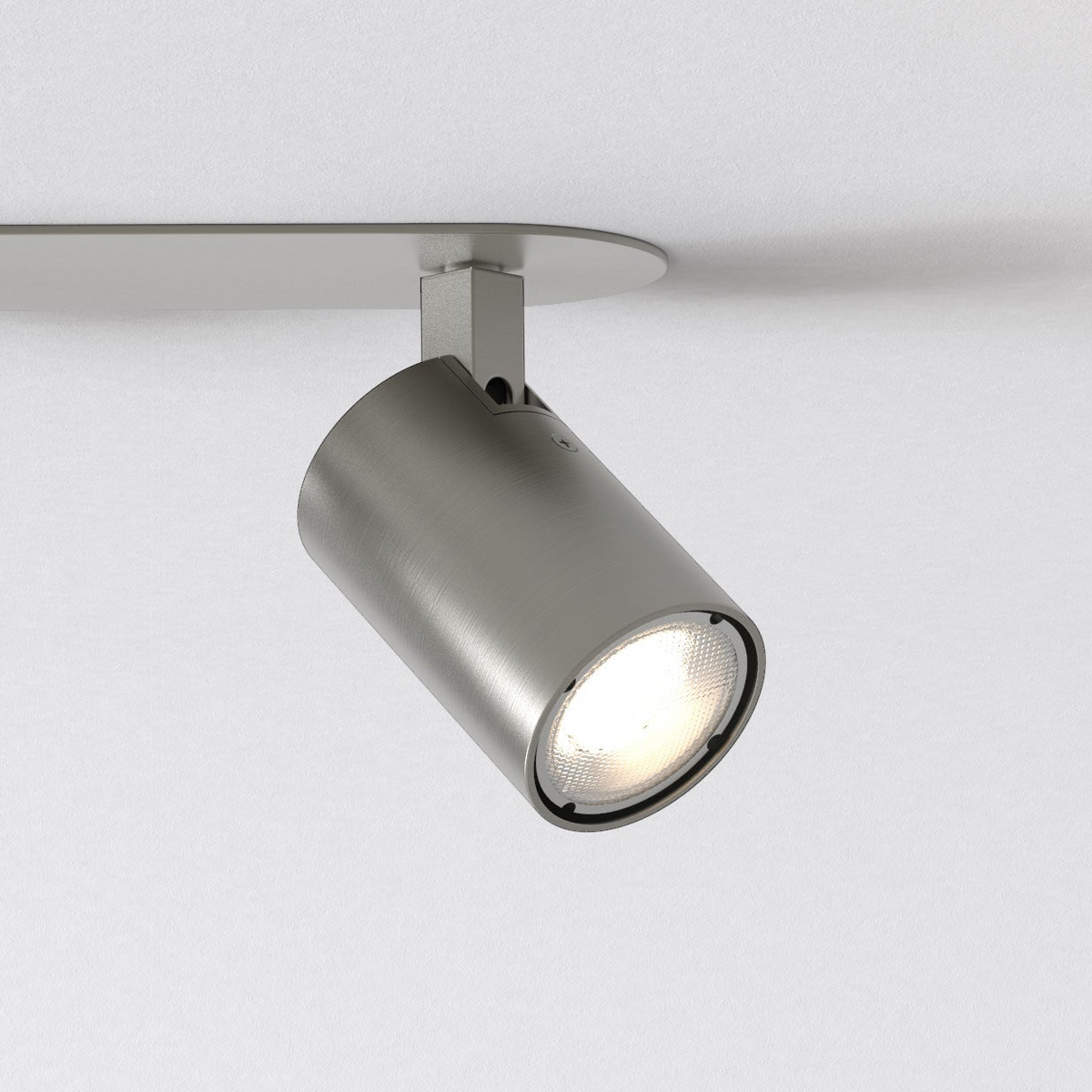 Brushed steel ceiling spotlight with a bright bulb