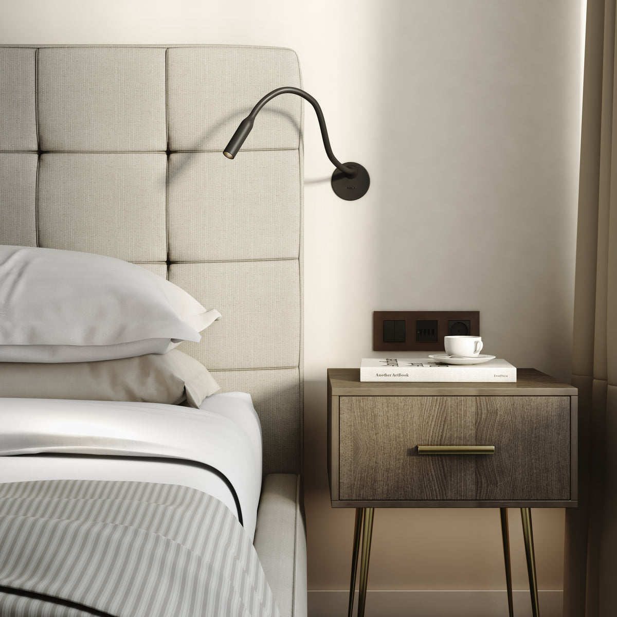 Bedroom with a bed, nightstand, and wall-mounted reading light