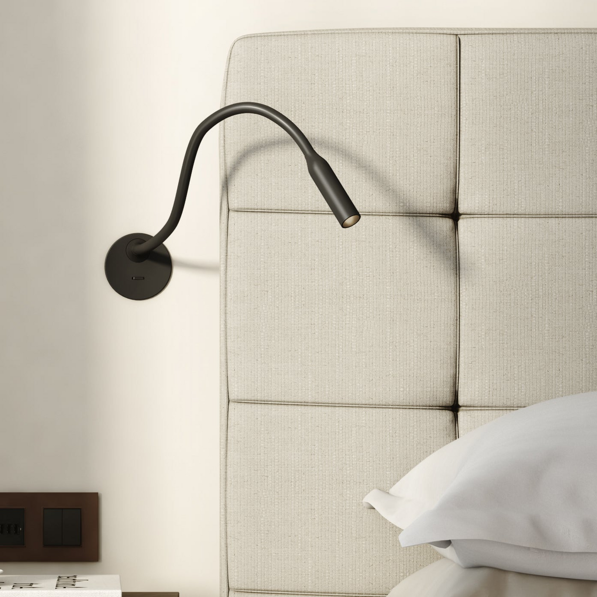 Astro Lucca Recessed Switched LED Reading Light in Matt Black mounted on a wall next to a headboard