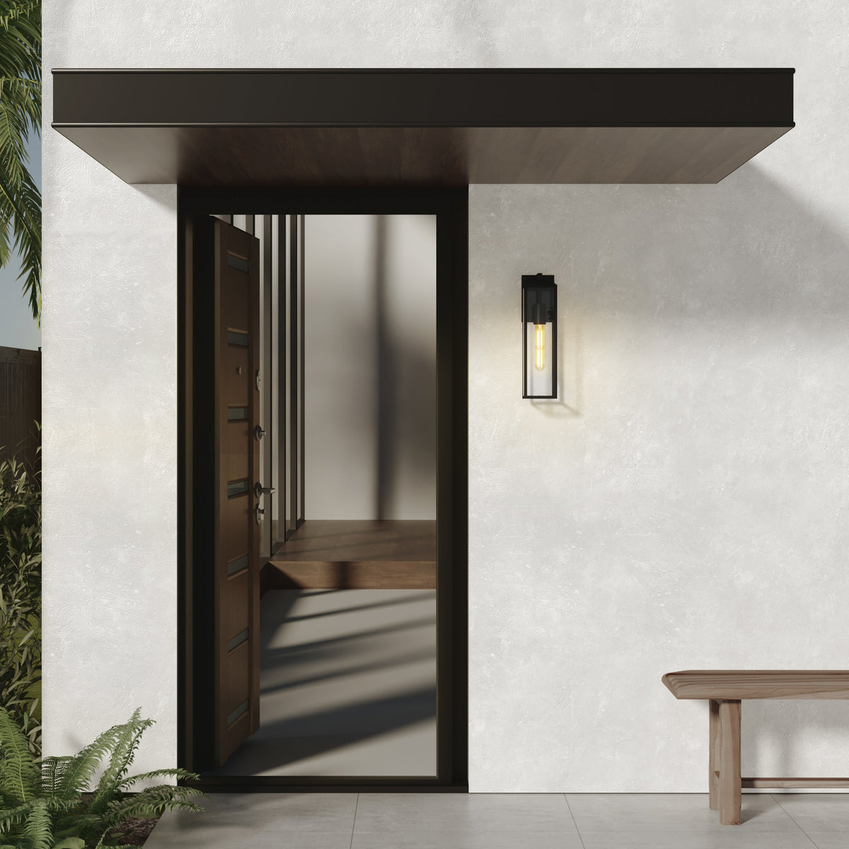 Modern home exterior with open wooden door, black awning, and a sleek outdoor wall light