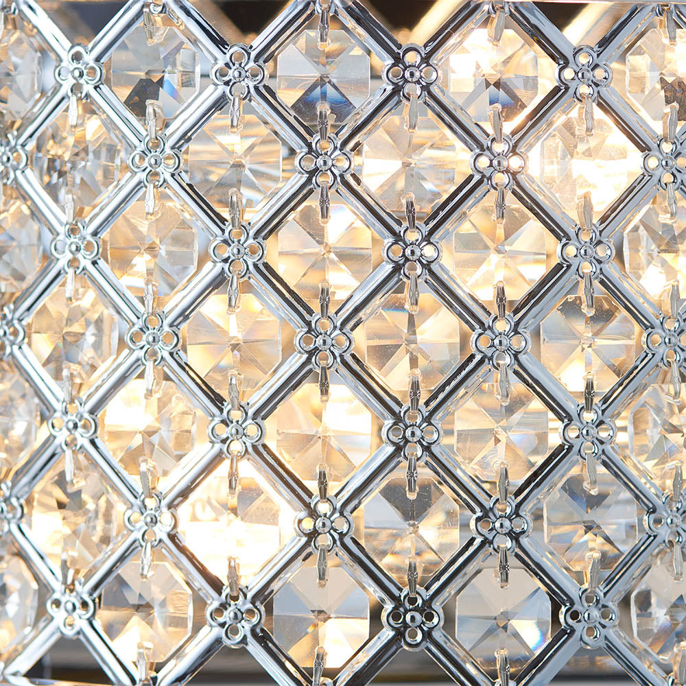 Detailed close-up of the crystal grid pattern on a wall light, showing individual faceted crystals.