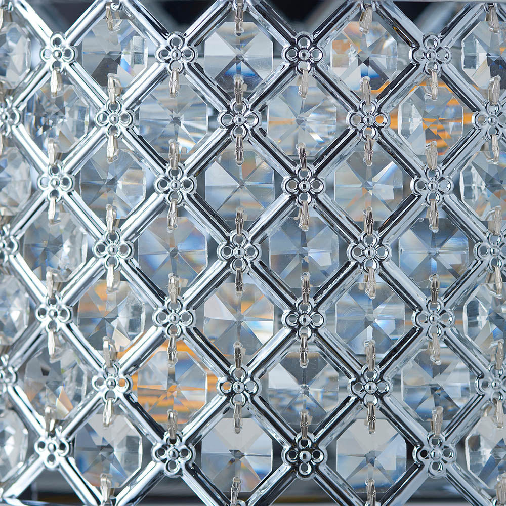 Extreme close-up of the crystal grid pattern on a wall light, highlighting the intricate details and reflections.