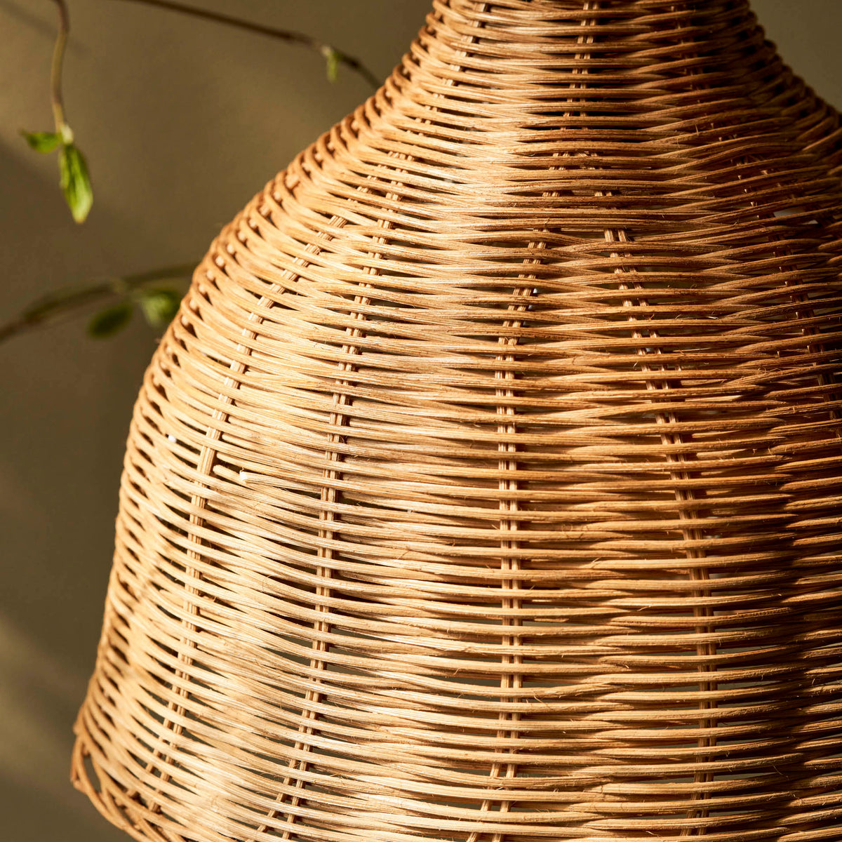 Detailed view of the woven rattan pattern on the Mouldon Small Pendant in Rattan by Garden Trading Lighting