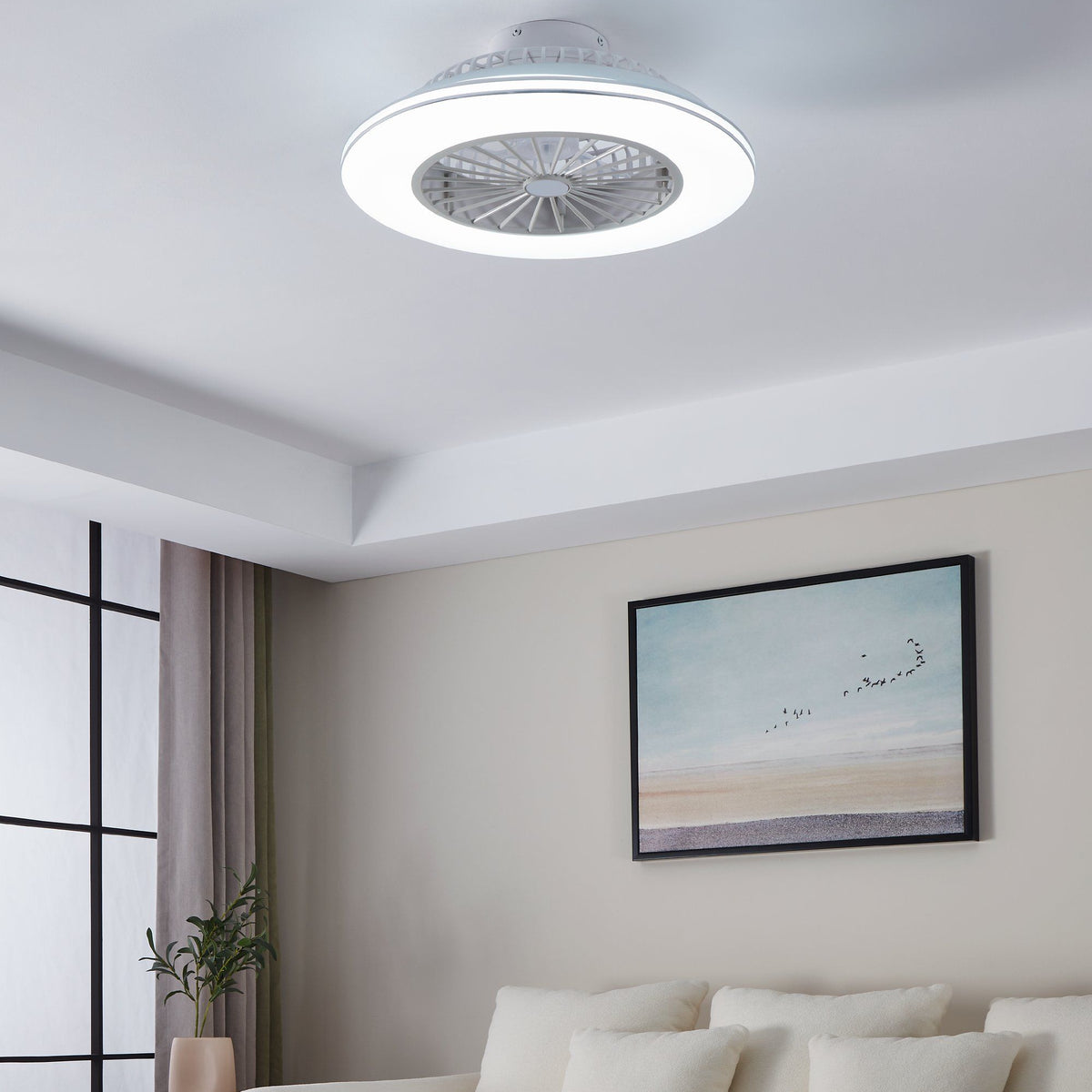 White ceiling fan with integrated LED light in a modern living room