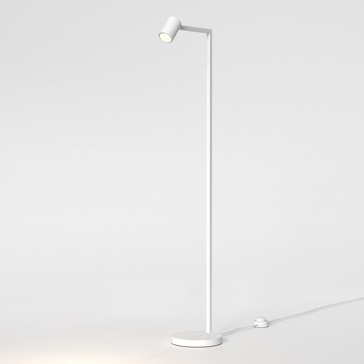White floor lamp with a cylindrical head and a round base, casting light downwards