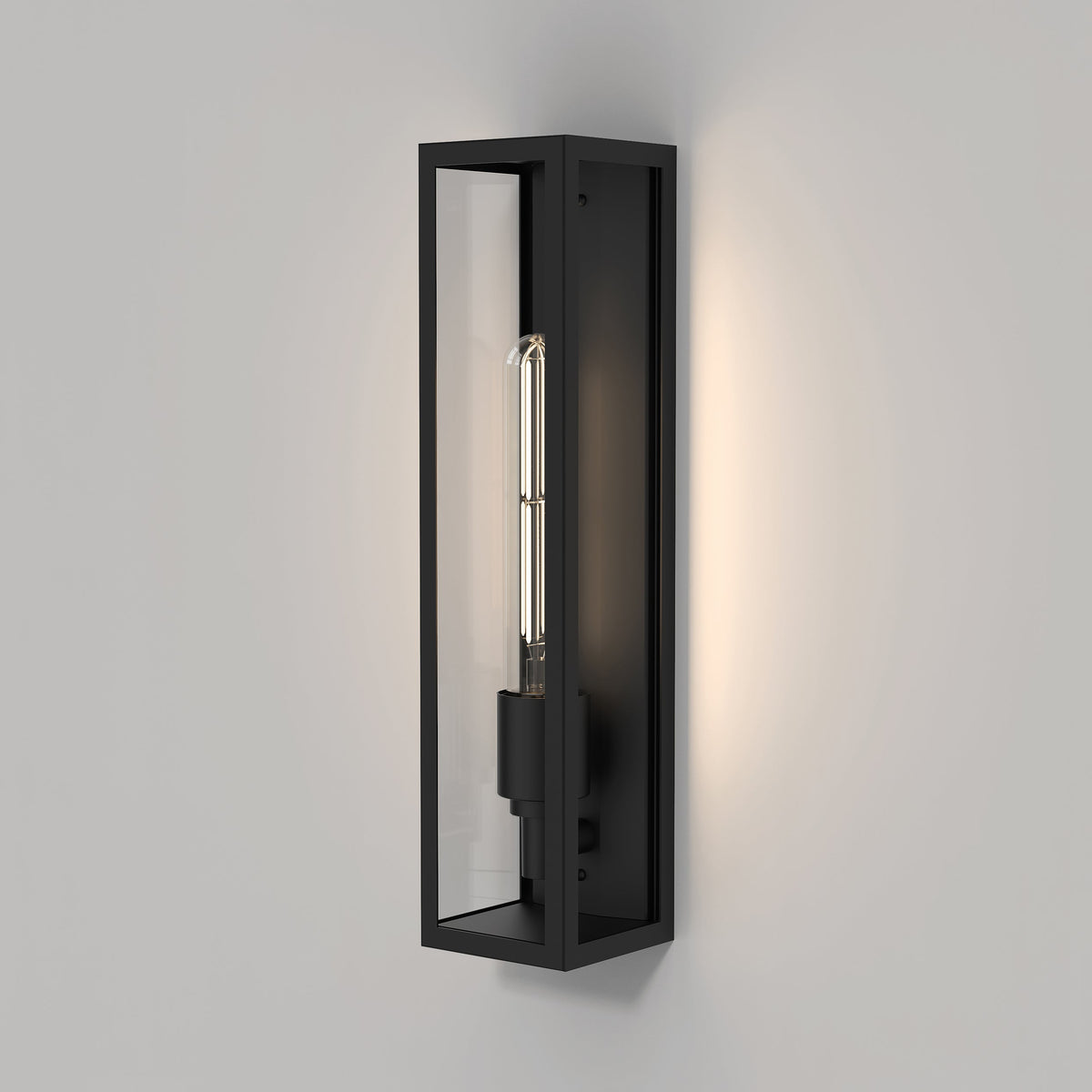 Black rectangular wall sconce with a clear glass shade and an exposed filament bulb