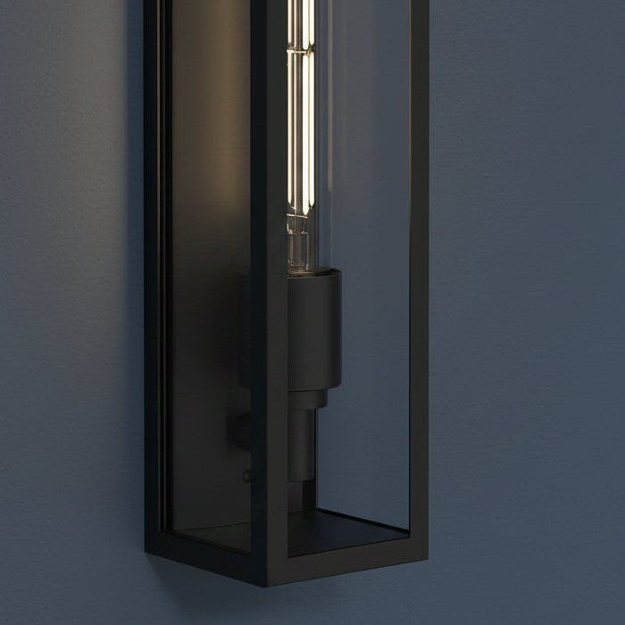 Black rectangular wall light with a clear glass shade and a visible filament bulb