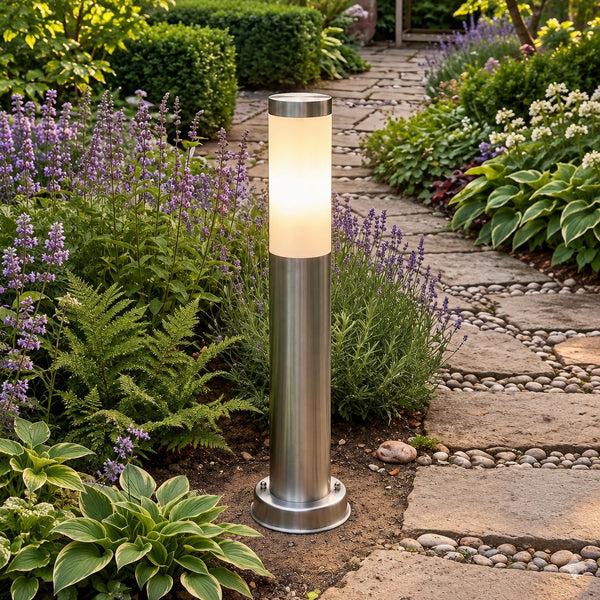 Firstlight Plaza Small Post Light in stainless steel standing in a garden path