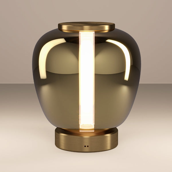 Modern table lamp with a bronze base and a dark, reflective glass shade, featuring a vertical illuminated strip.